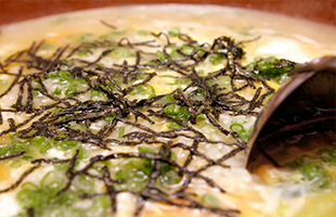 カニ料理のシメは絶品のカニ雑炊の写真